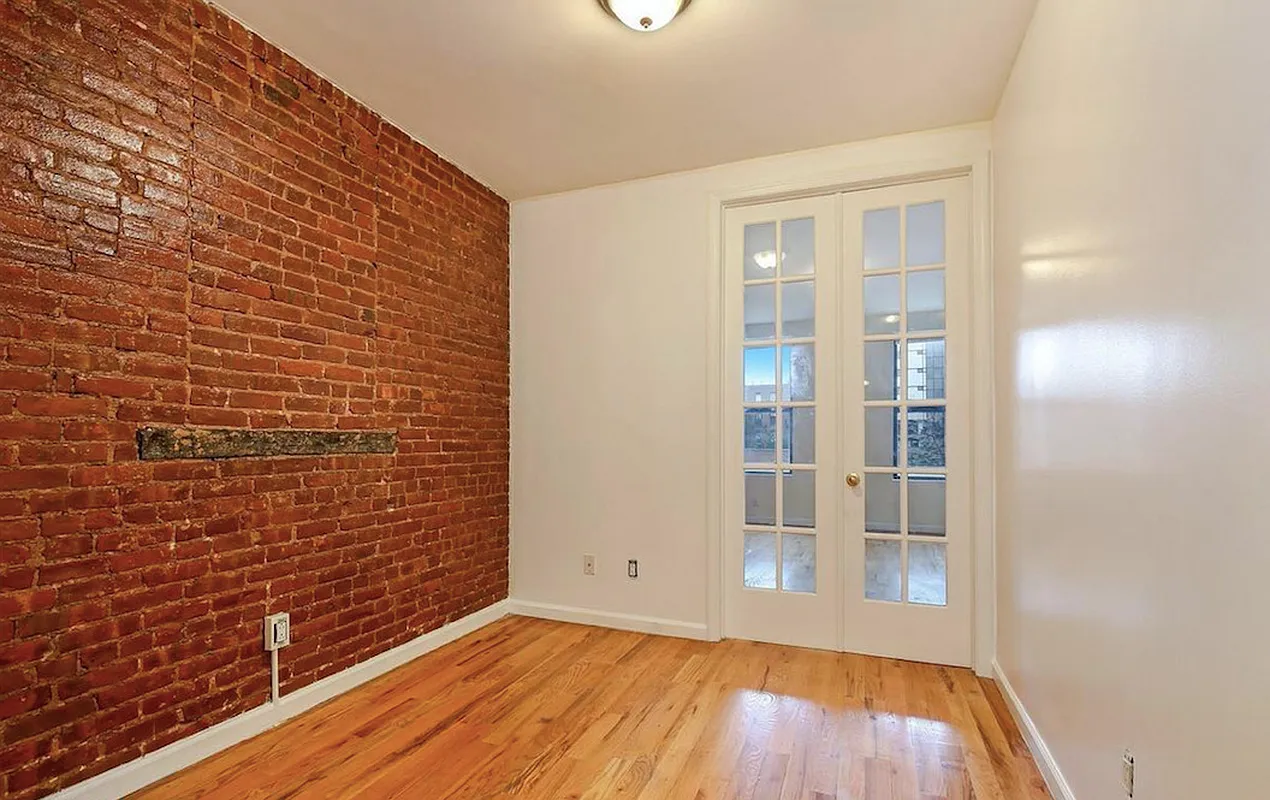 477 Hicks Street, Unit 2R Brooklyn, NY 11231 - Photo 4 of 7 a view of an empty room with wooden floor and a window