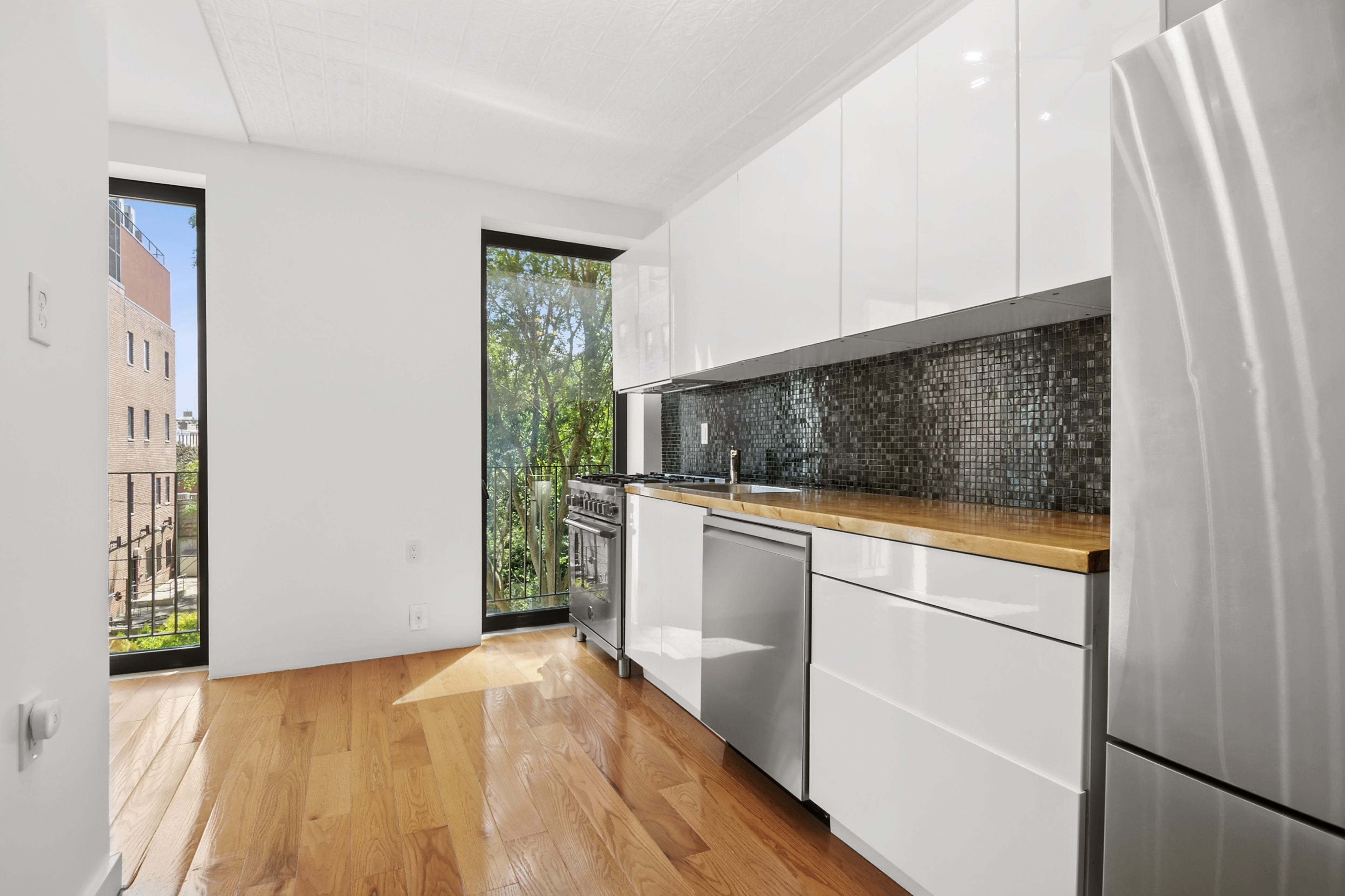 110 Butler Street, Unit 2 Brooklyn, NY 11231 - Photo 3 of 9 a view of hallway with washer and dryer