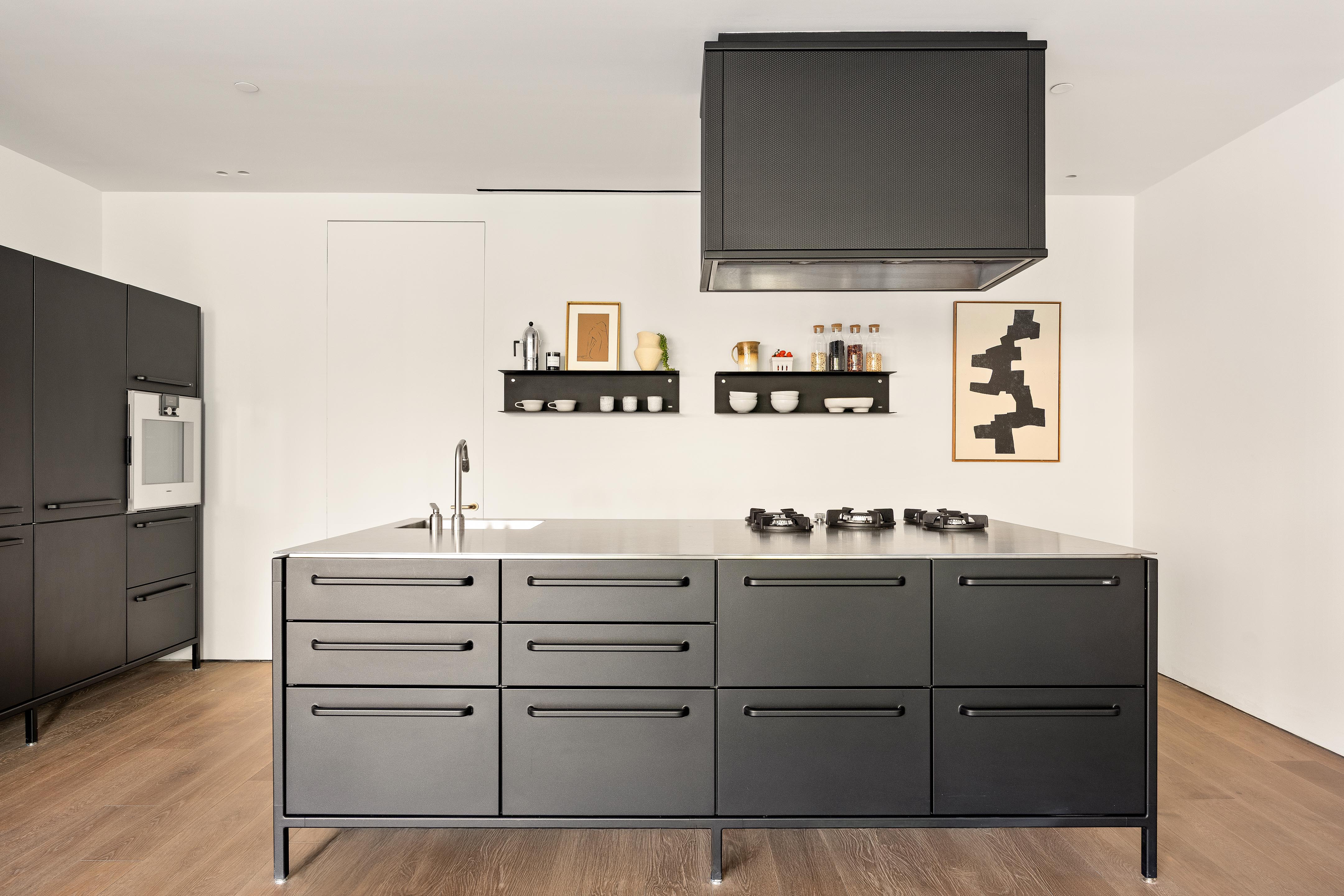 455 West 19th Street, Unit 3 Manhattan, NY 10011 - Photo 13 of 30 a kitchen with cabinets and stainless steel appliances