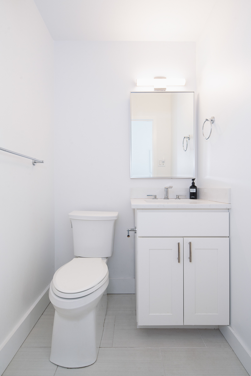 35 East 10th Street, Unit 4J Manhattan, NY 10003 - Photo 10 of 19 a bathroom with a toilet sink and mirror