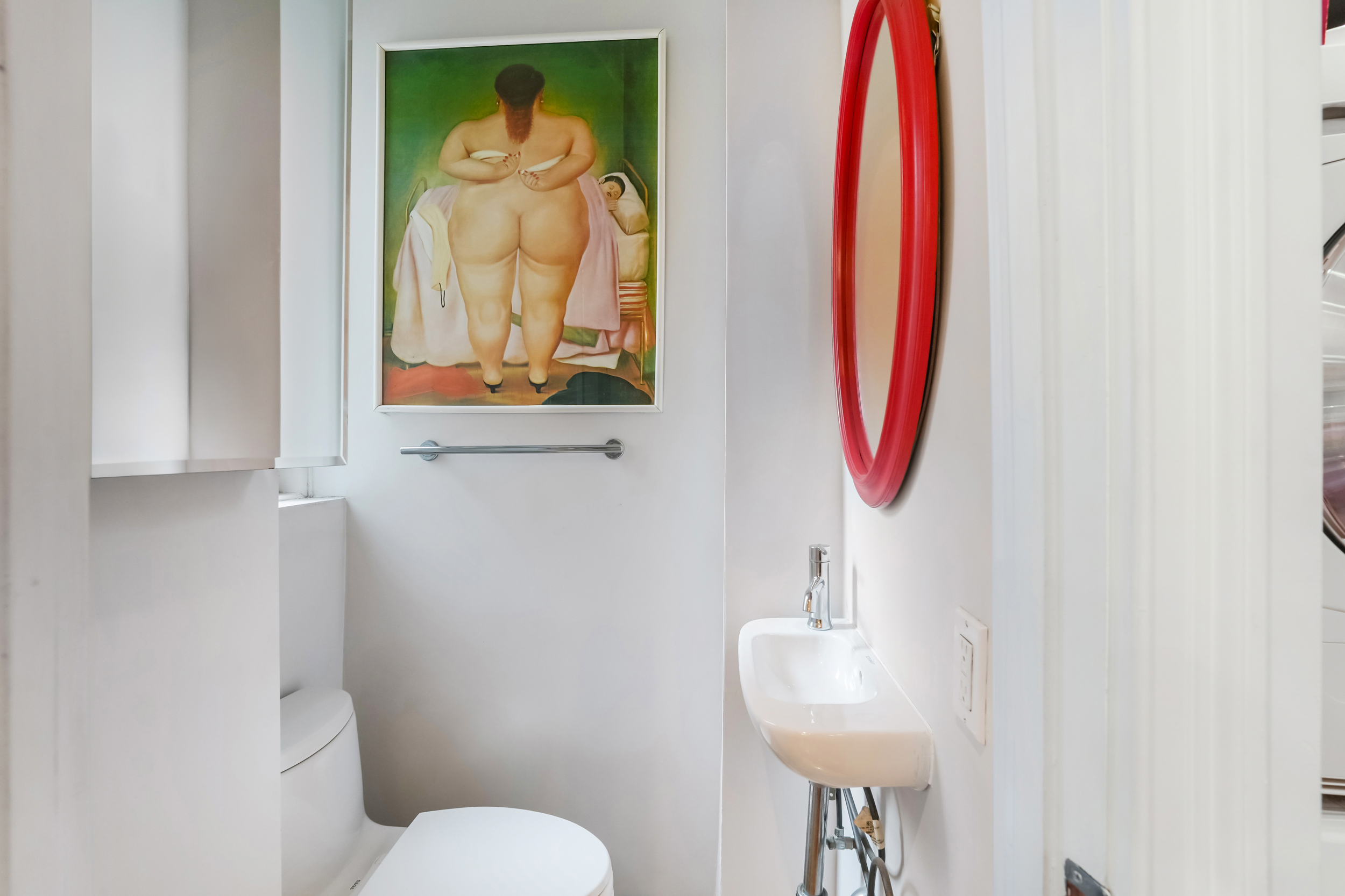 240 West 98th Street, Unit 3D Manhattan, NY 10025 - Photo 10 of 12 a bathroom with a sink and a mirror