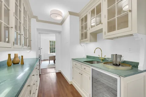 a kitchen with stainless steel appliances granite countertop a sink and cabinets