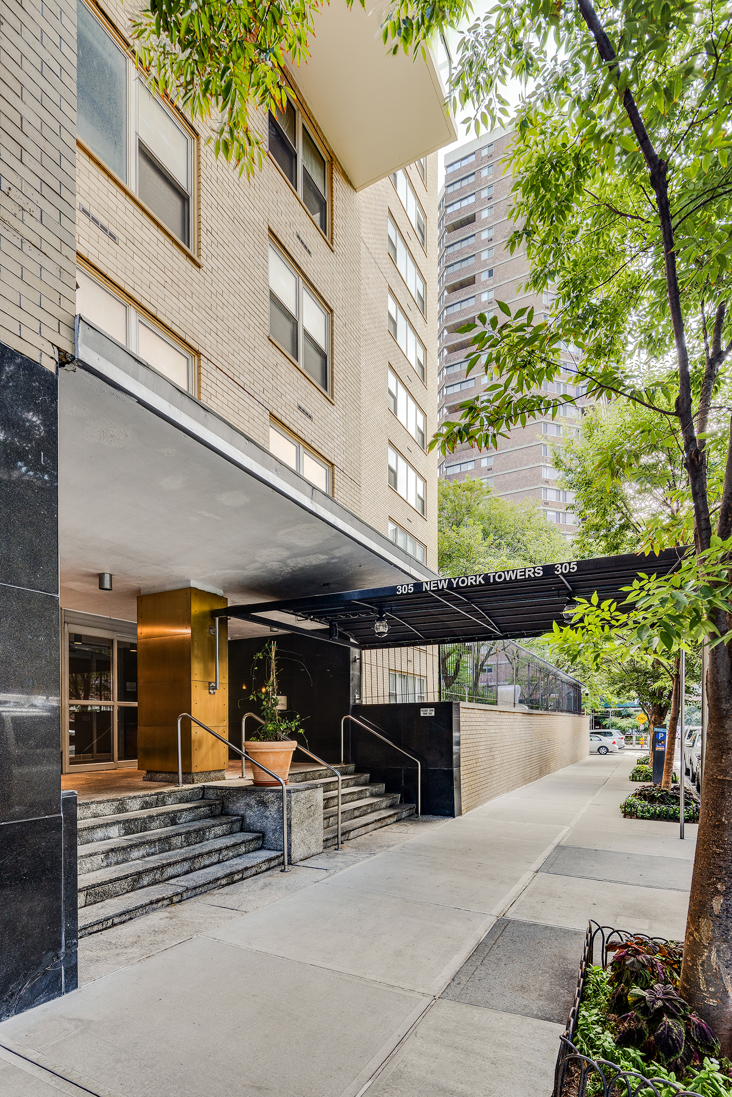 305 East 24th Street, Unit 11G Manhattan, NY 10010 - Photo 9 of 10 a view of a building with sitting area and furniture