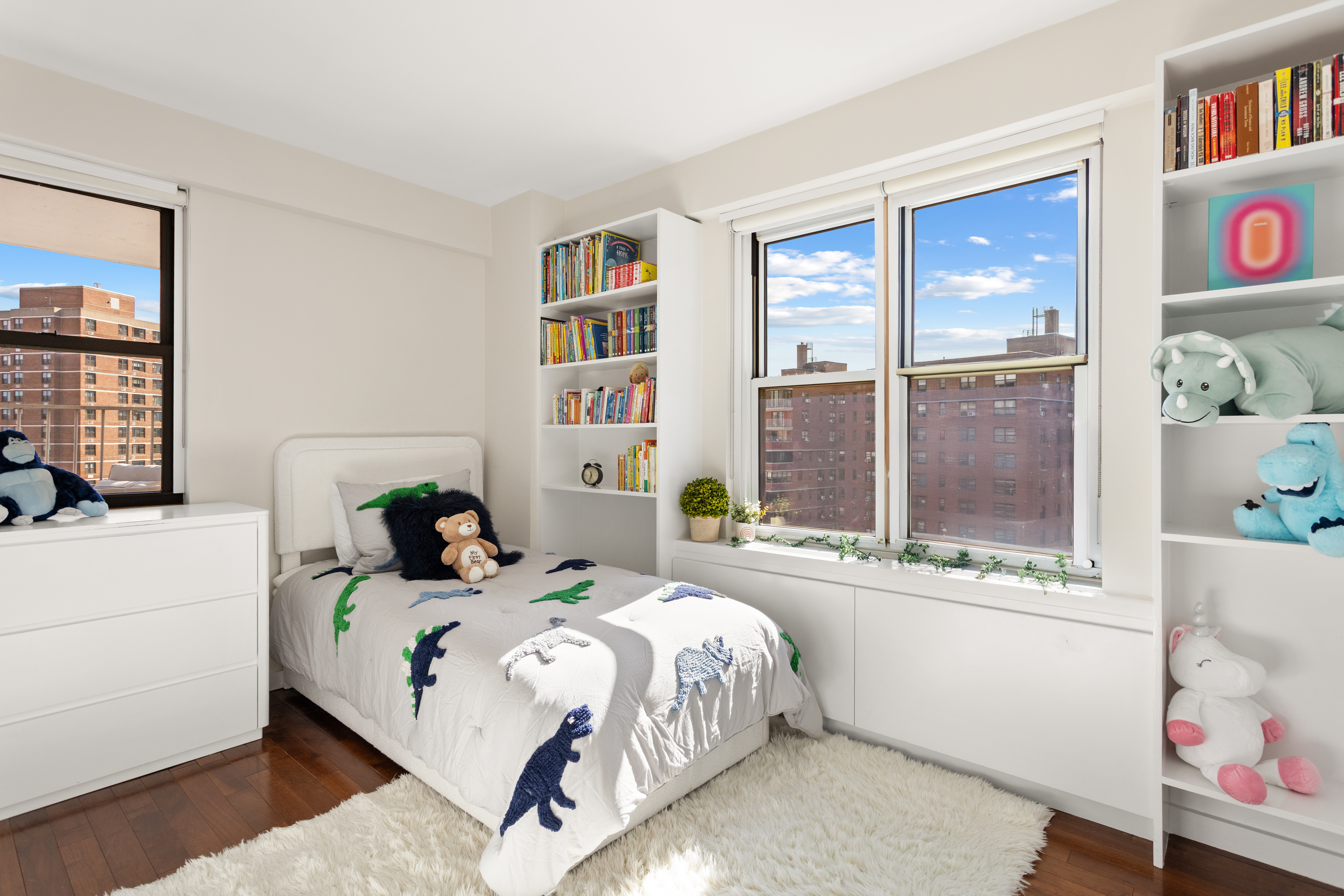 417 Grand Street, Unit D1801 Manhattan, NY 10002 - Photo 8 of 23 a bedroom with a bed and a window