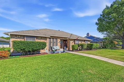 an aerial view of a house with a garden