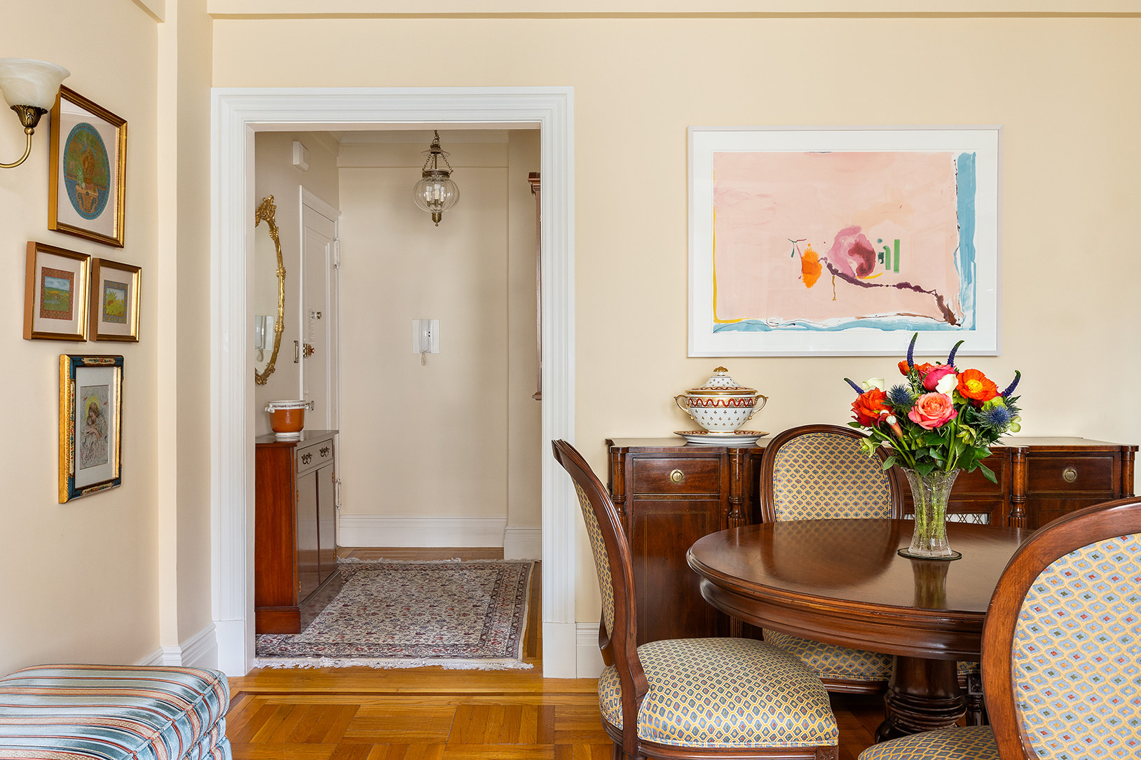 119 East 84th Street, Unit 9C Manhattan, NY 10028 - Photo 3 of 10 a living room with furniture and flowers
