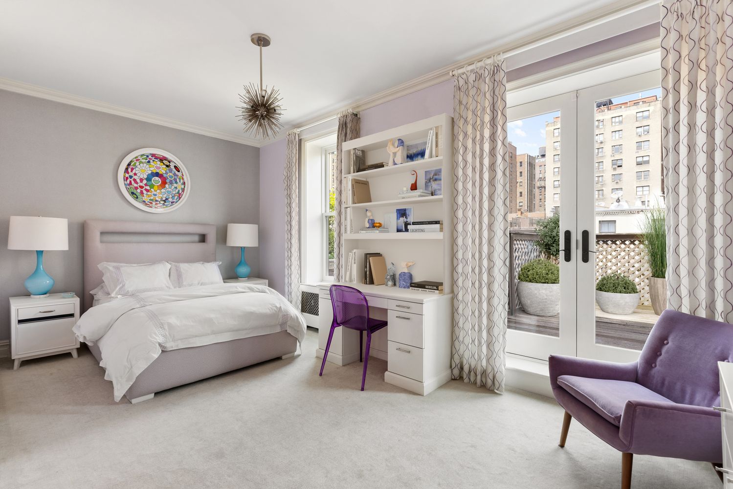 a bedroom with a bed and a couch