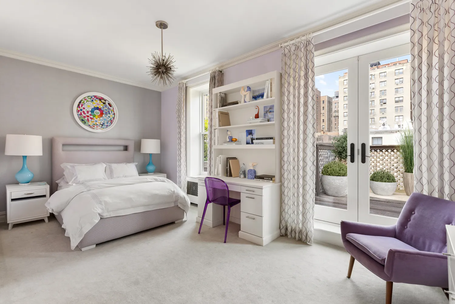 a bedroom with a bed and a couch