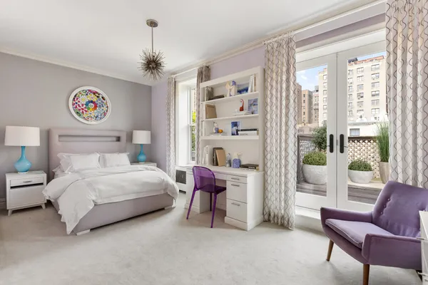 a bedroom with a bed and a couch