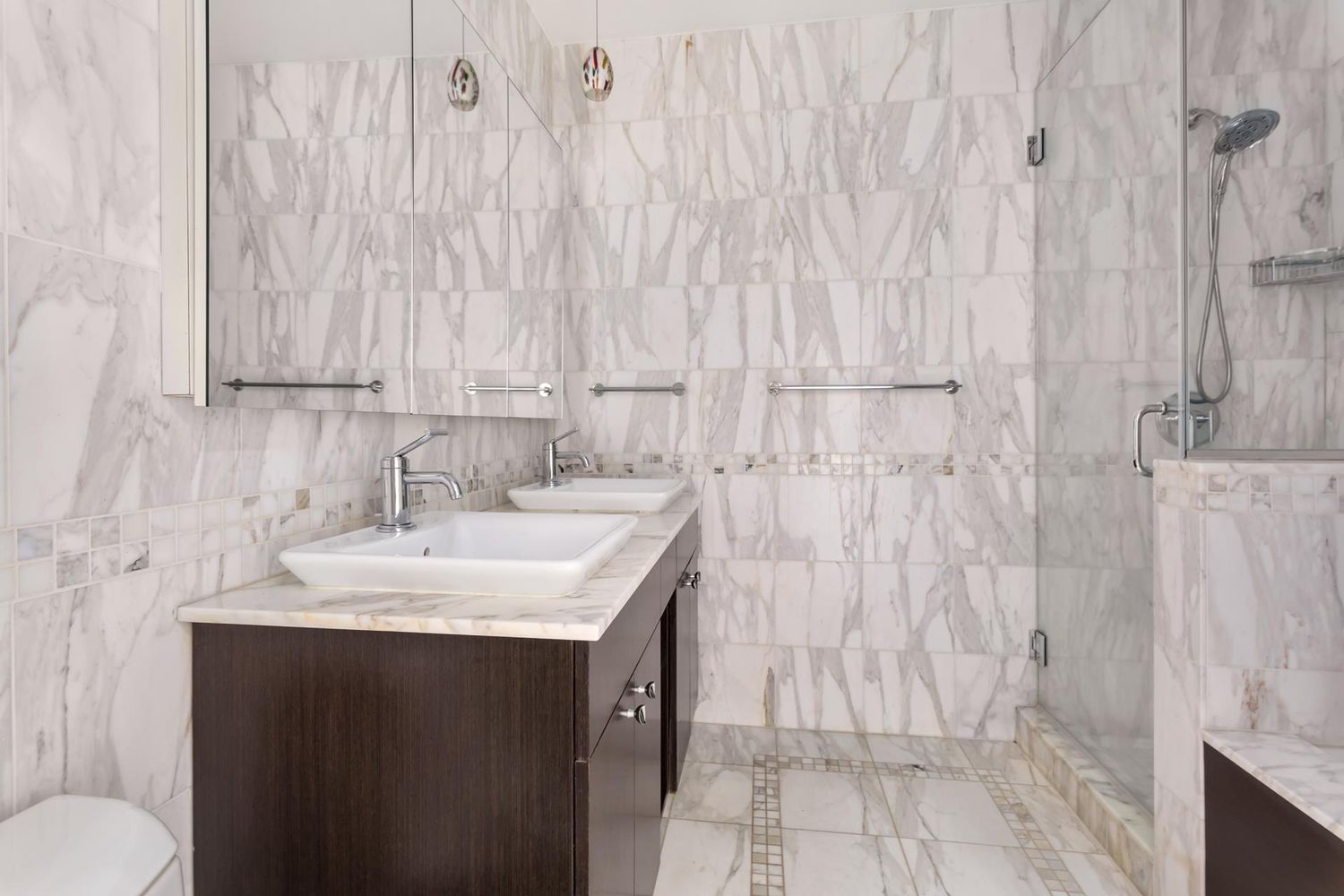 212 East 57th Street, Unit 18A Manhattan, NY 10022 - Photo 9 of 14 a bathroom with a sink and a toilet