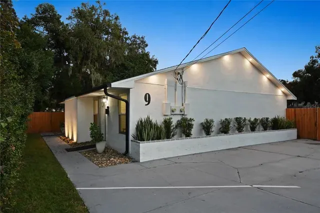 a front view of a house with trees