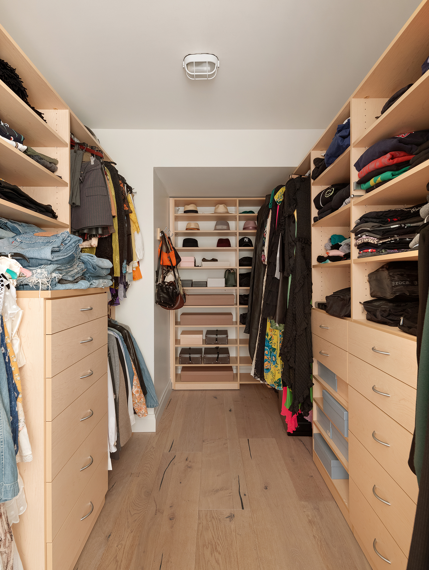 101 Warren Street, Unit 2010 Manhattan, NY 10007 - Photo 13 of 18 a view of walk in closet with clothes and shoes