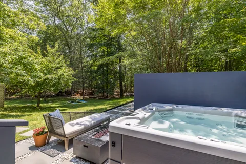 a backyard of a house with outdoor seating