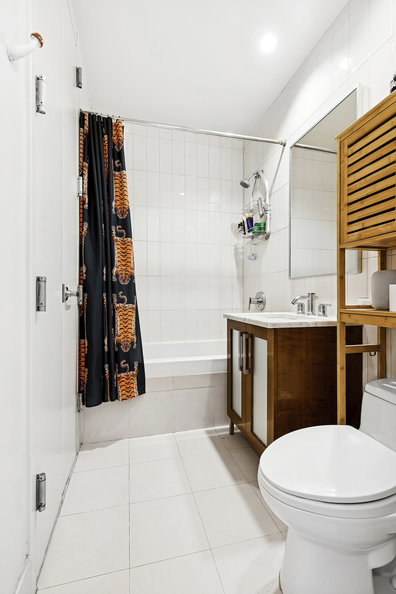78 Roebling Street, Unit 2B Brooklyn, NY 11211 - Photo 6 of 7 a bathroom with a sink toilet and shower