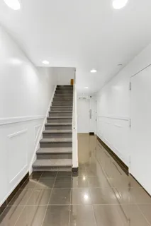 a view of an empty room with stairs