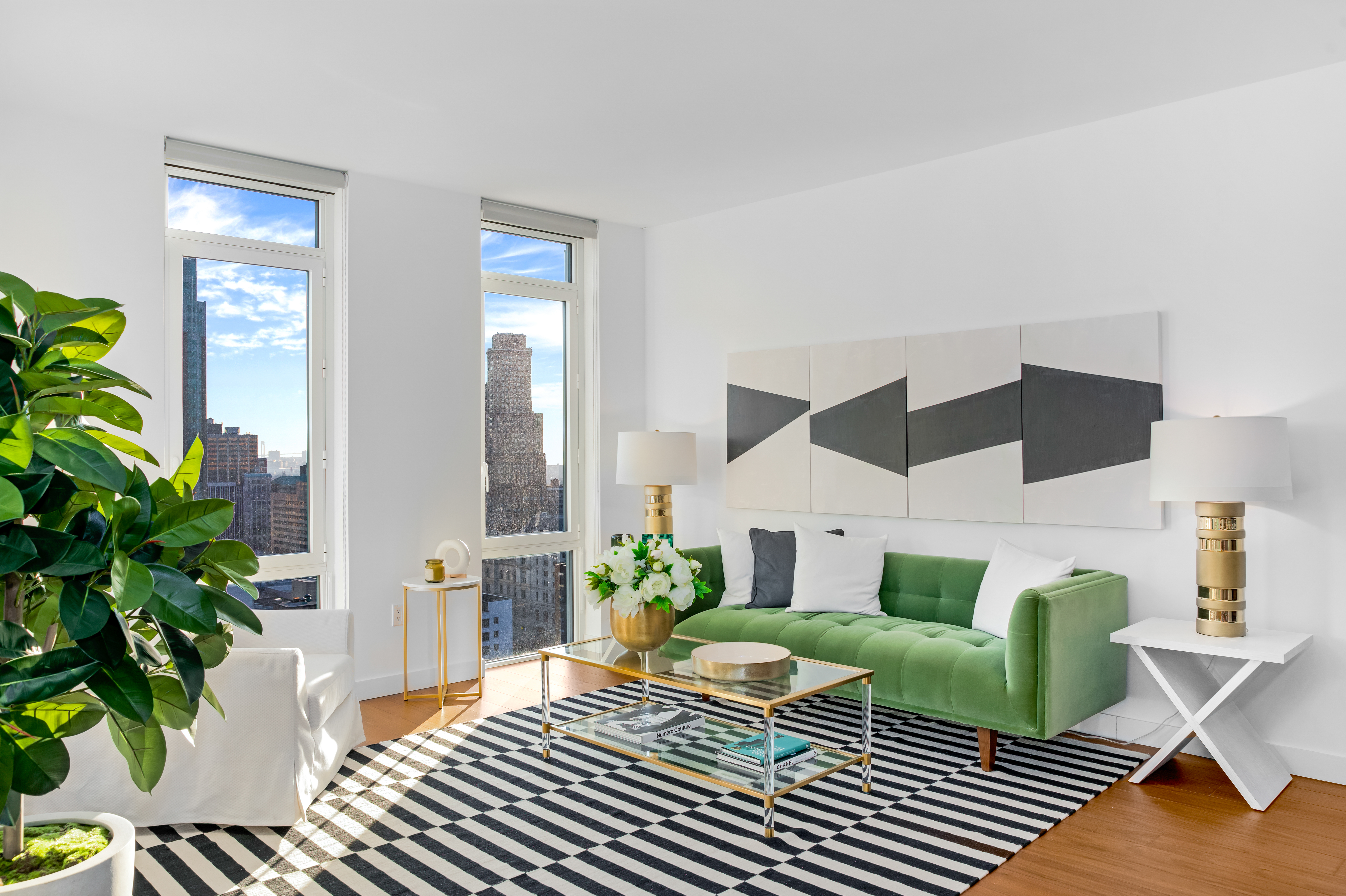 120 Nassau Street, Unit 14G Brooklyn, NY 11201 - Photo 1 of 11 a living room with furniture and a potted plant