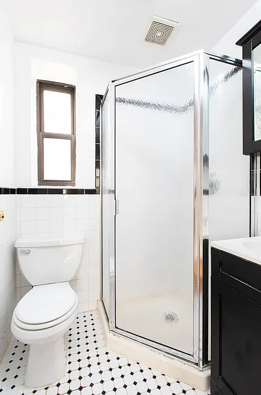 649 East 9th Street, Unit D3 Manhattan, NY 10009 - Photo 5 of 5 a bathroom with a shower a toilet and a window