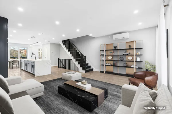 a living room with furniture or couch and a book shelf