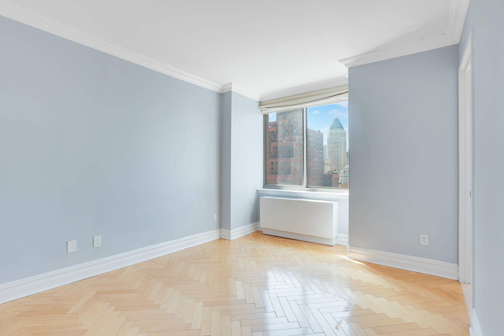 2 Columbus Avenue, Unit 17C Manhattan, NY 10023 - Photo 19 of 26 a view of an empty room with a window