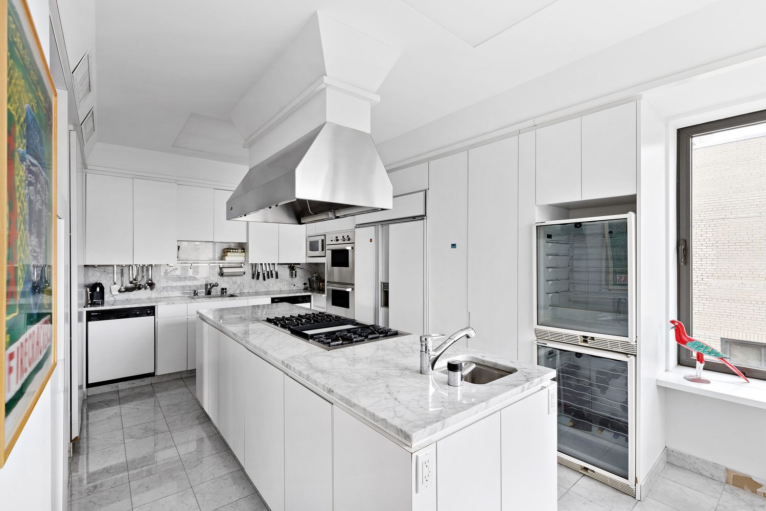 a kitchen with a stove and a refrigerator