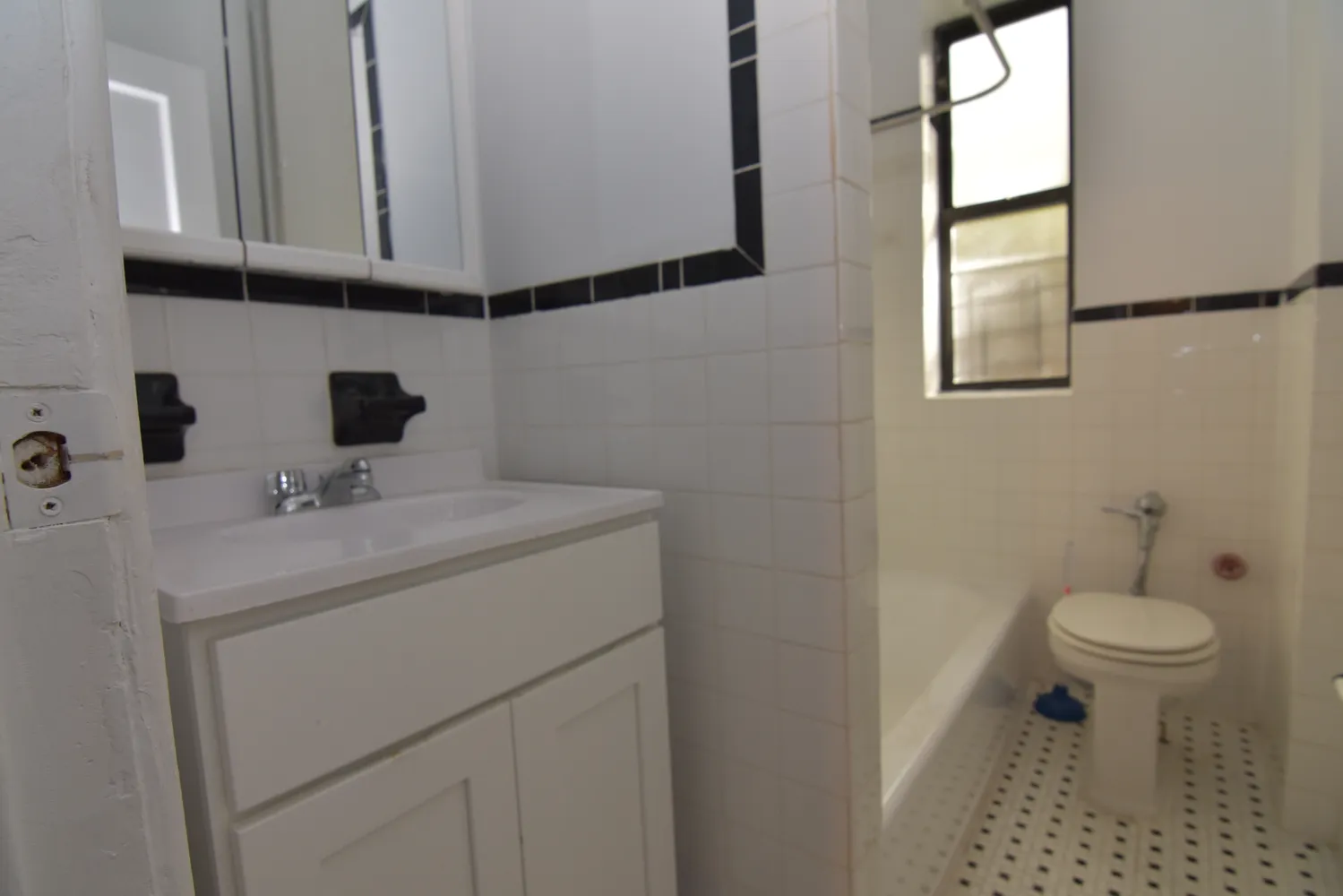 a bathroom with a sink toilet and vanity