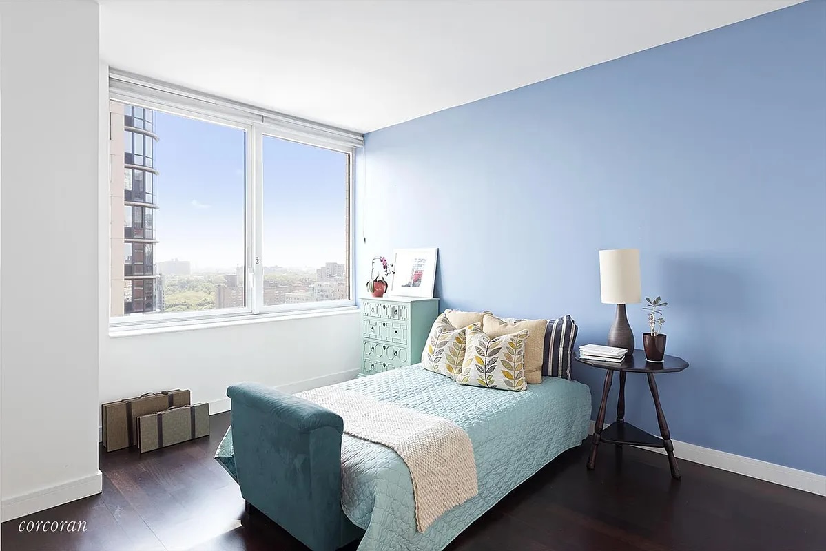 306 Gold Street, Unit 22B Brooklyn, NY 11201 - Photo 3 of 11 a bedroom with a bed and wooden floor