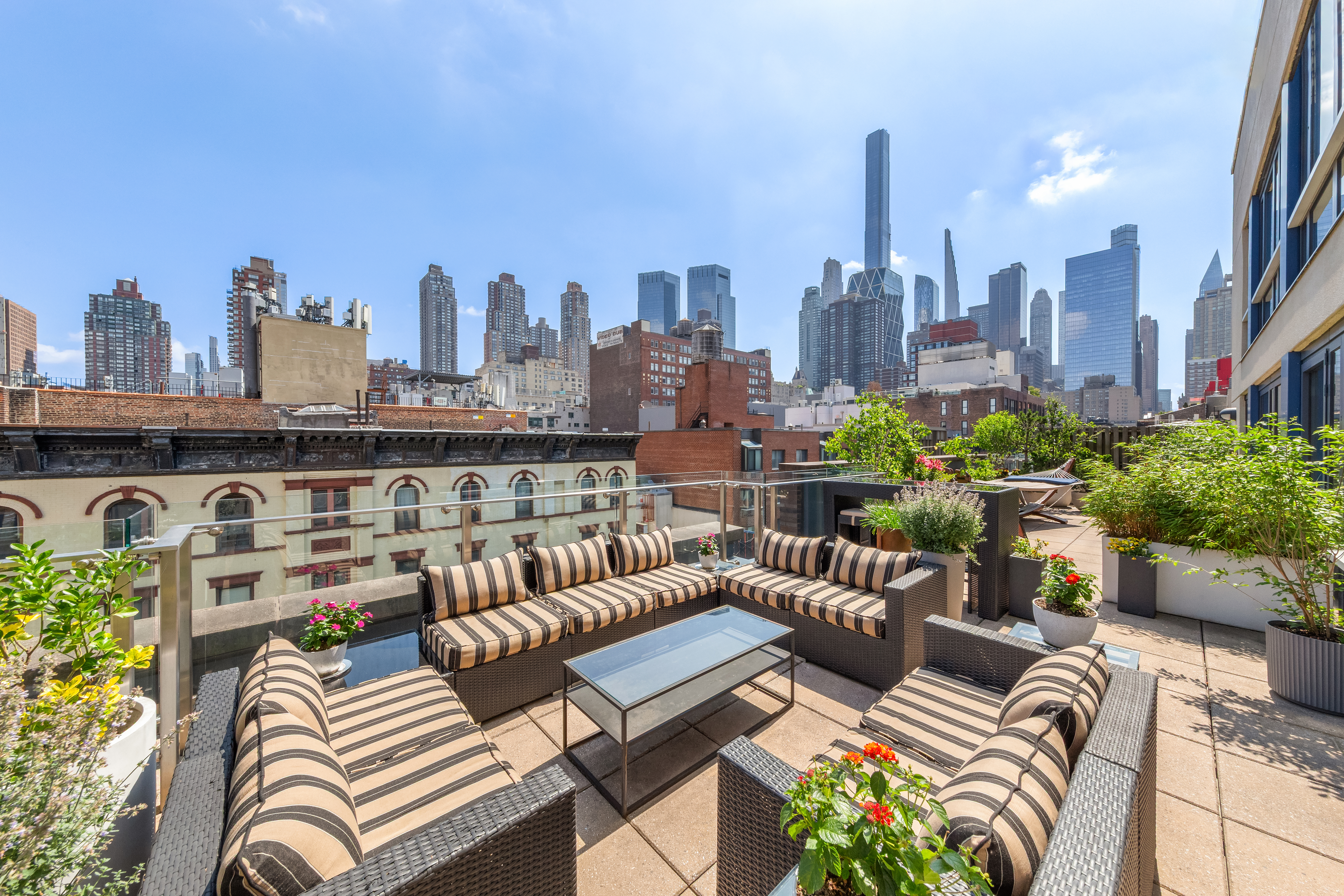 a view of a city from a couches in the patio