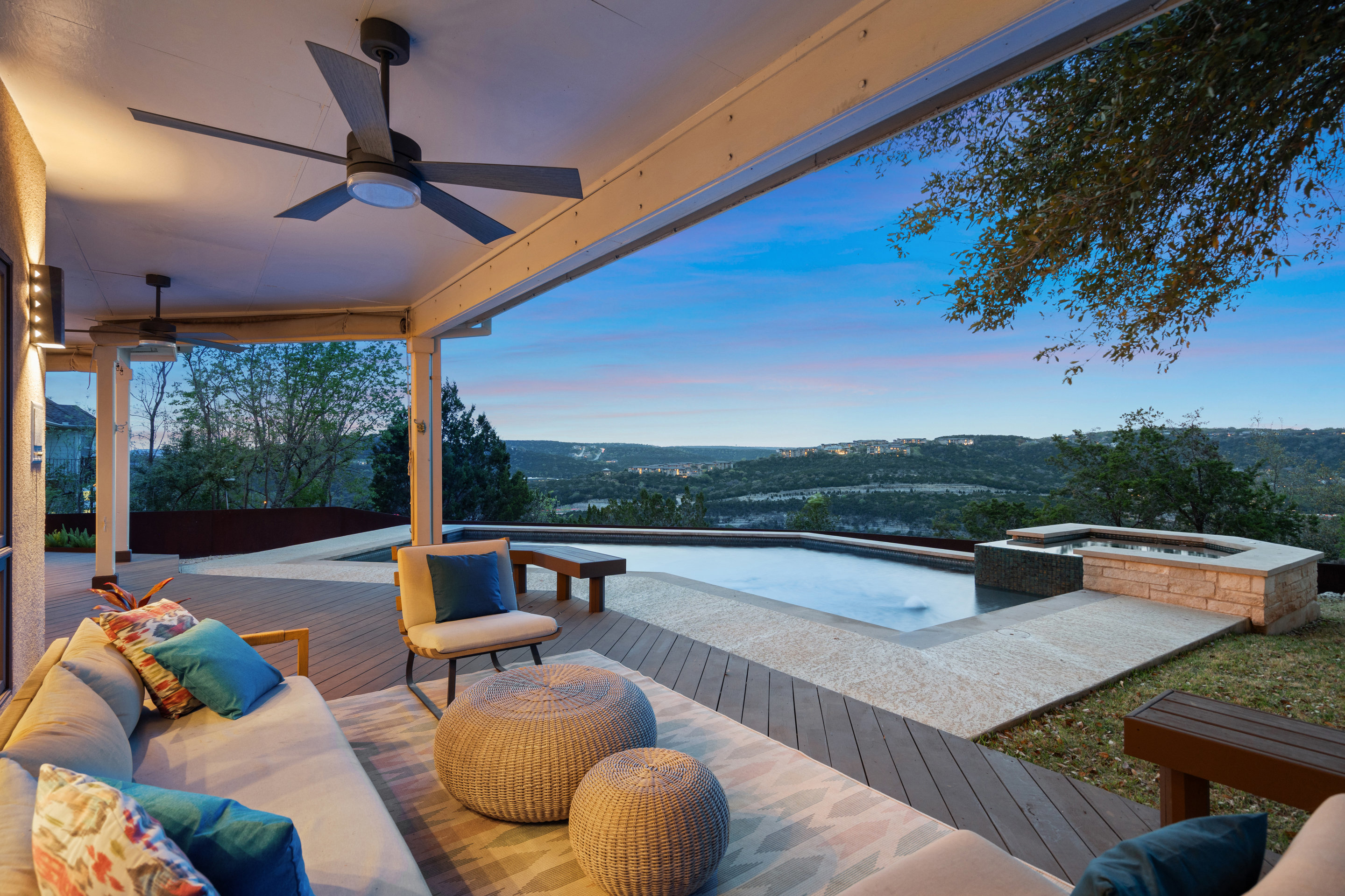 an outdoor sitting area with a table and chairs
