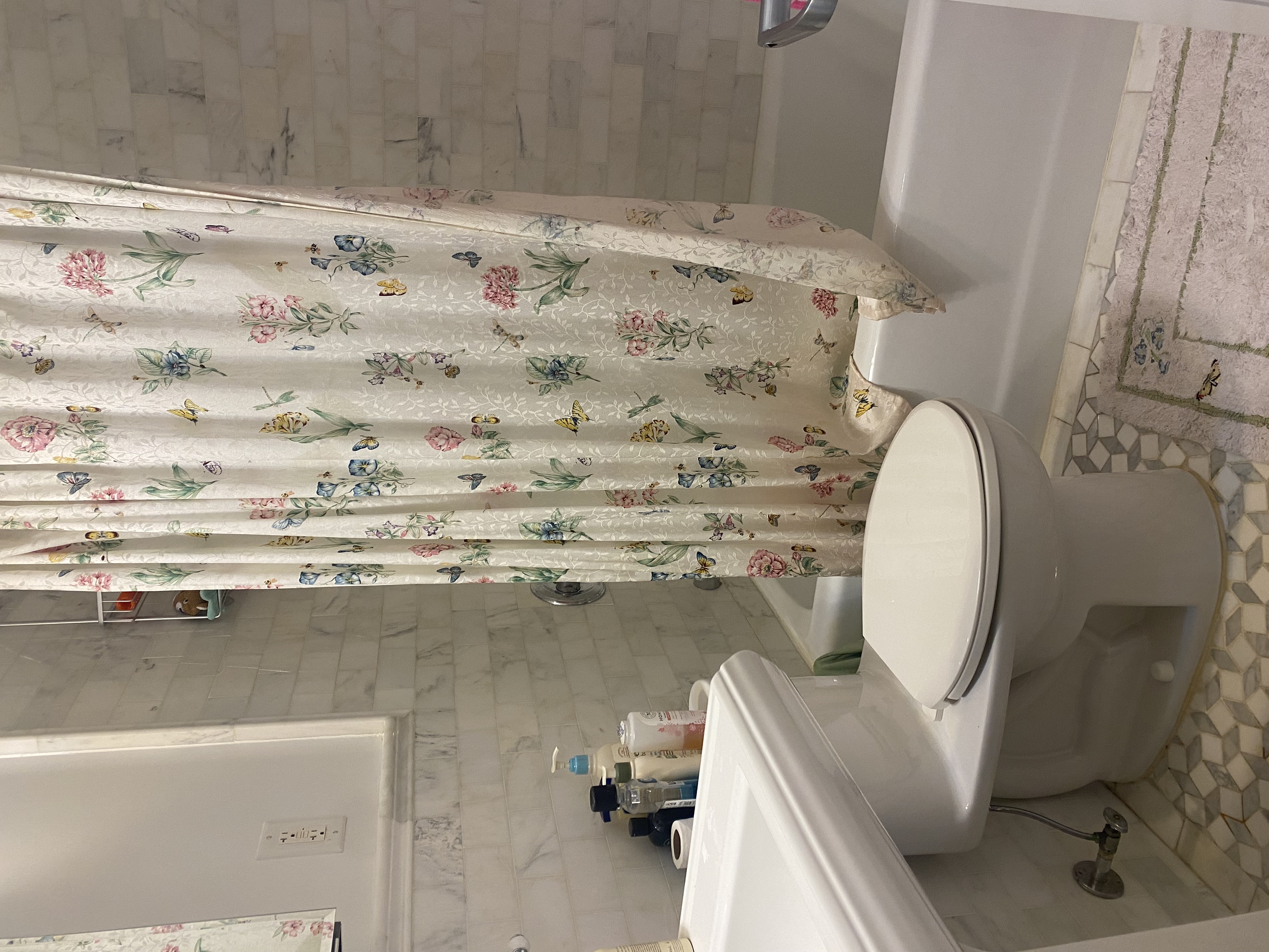 1240 Park Avenue, Unit 6B Manhattan, NY 10128 - Photo 7 of 13 a white toilet sitting next to a bath tub