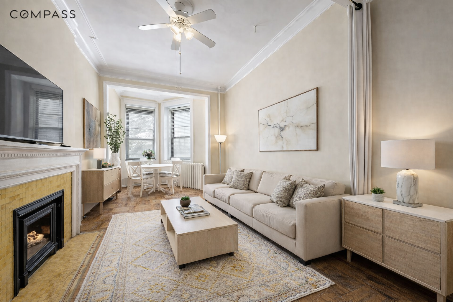 a living room with furniture and a fireplace