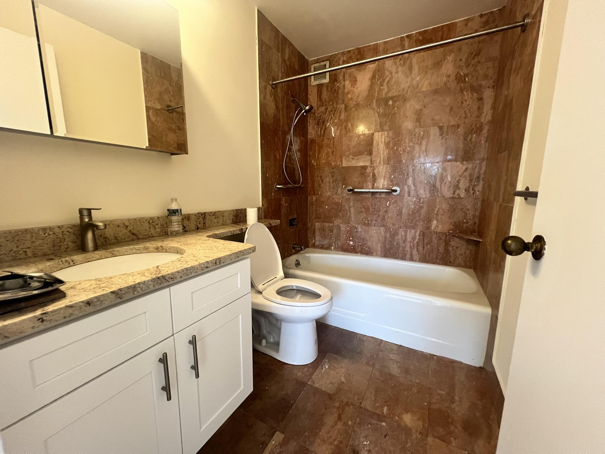 250 West 90th Street, Unit PH2F Manhattan, NY 10024 - Photo 14 of 21 a bathroom with a granite countertop sink a toilet and bathtub
