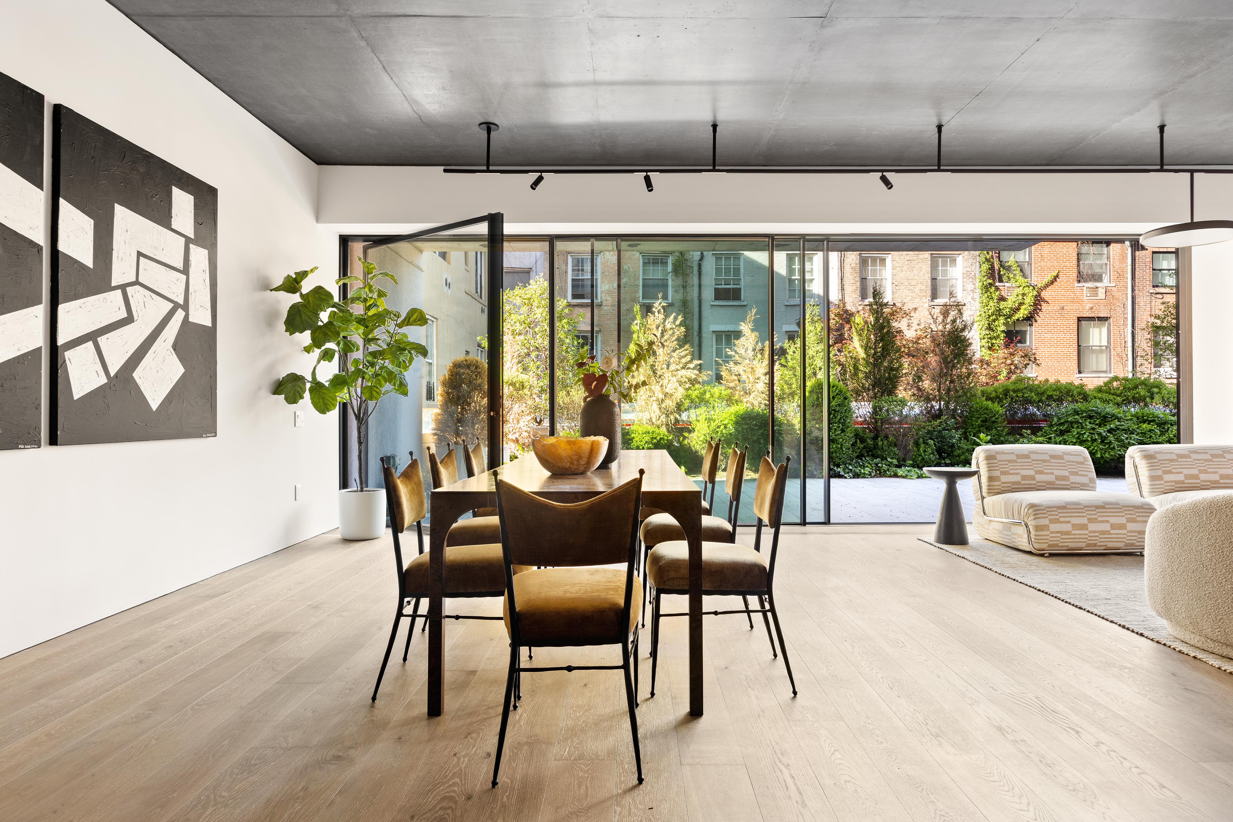 455 West 19th Street, Unit 3 Manhattan, NY 10011 - Photo 14 of 30 a dining room with furniture a chandelier and wooden floor