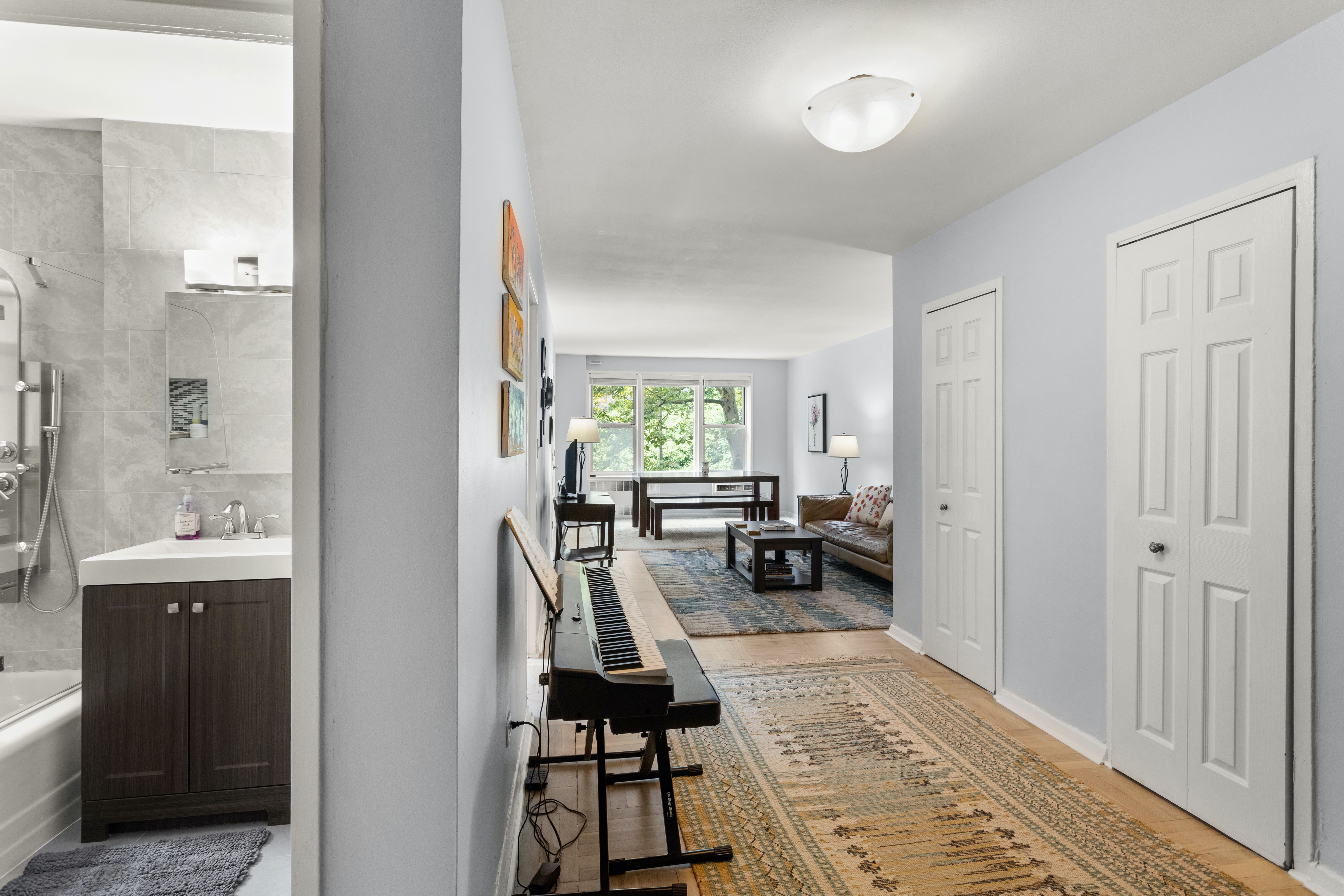 66 Overlook Terrace, Unit 4K Manhattan, NY 10040 - Photo 14 of 26 a view of a livingroom with furniture and a window