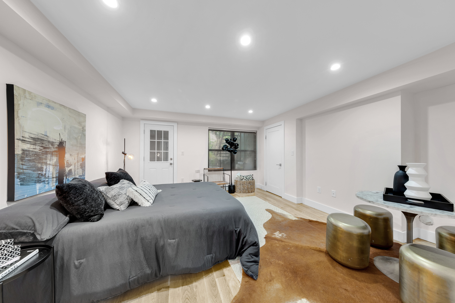 1118 Decatur Street Brooklyn, NY 11207 - Photo 14 of 18 a bedroom with a bed and wooden floor