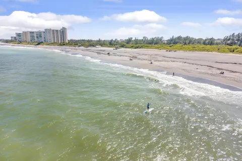 a view of an ocean and city