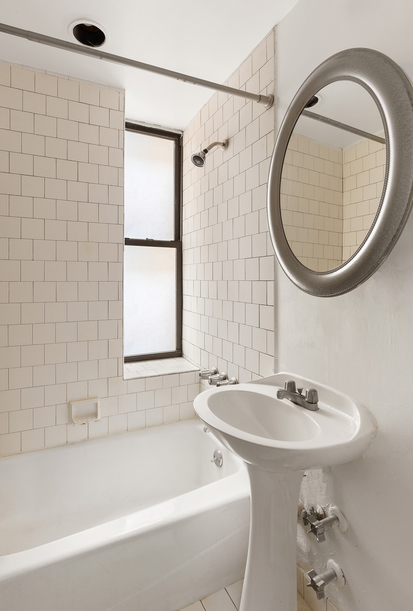 300 8th Avenue, Unit 4G Brooklyn, NY 11215 - Photo 5 of 6 a bathroom with a sink and a mirror