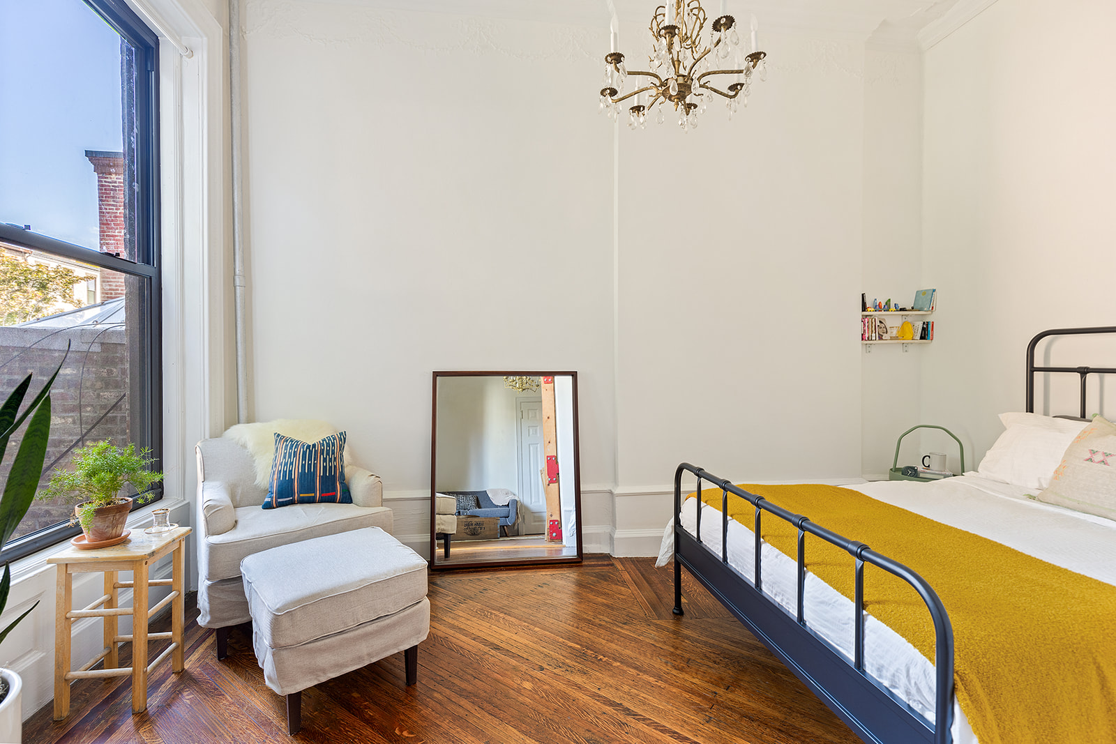 237 Hancock Street, Unit 5 Brooklyn, NY 11216 - Photo 4 of 8 a bedroom with a bed and a flat screen tv