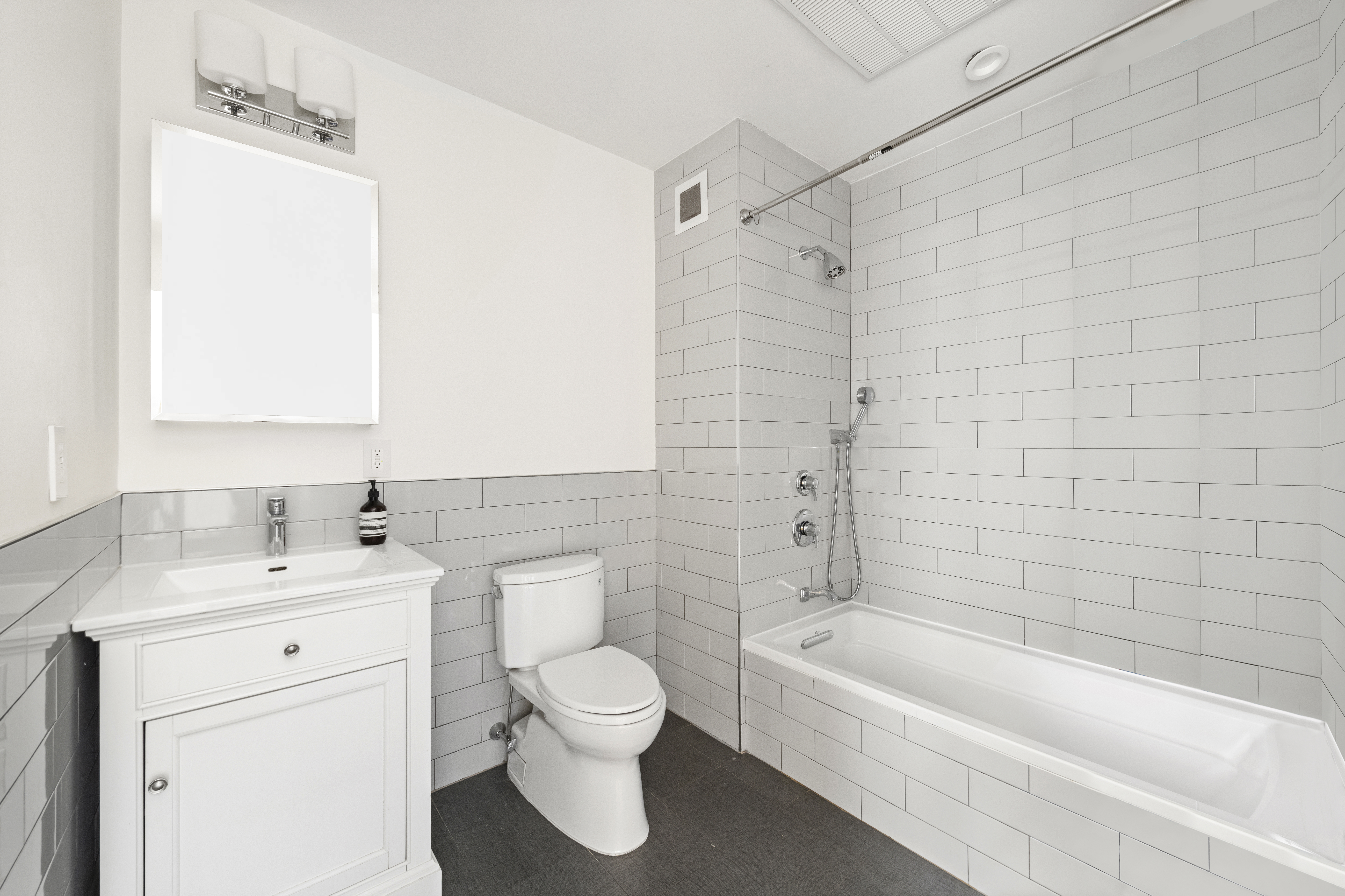 320 West 115th Street, Unit 4 Manhattan, NY 10026 - Photo 10 of 12 a bathroom with a sink a toilet and a bathtub