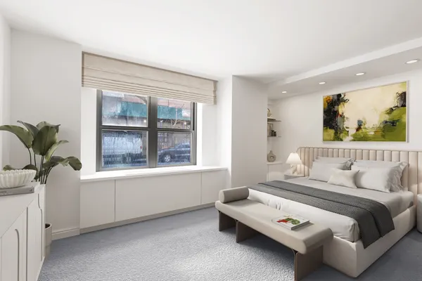 a bedroom with furniture and a window
