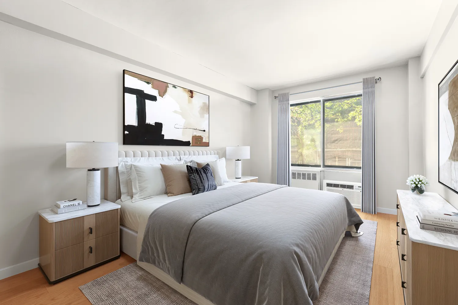 a bedroom with a bed and a night stand