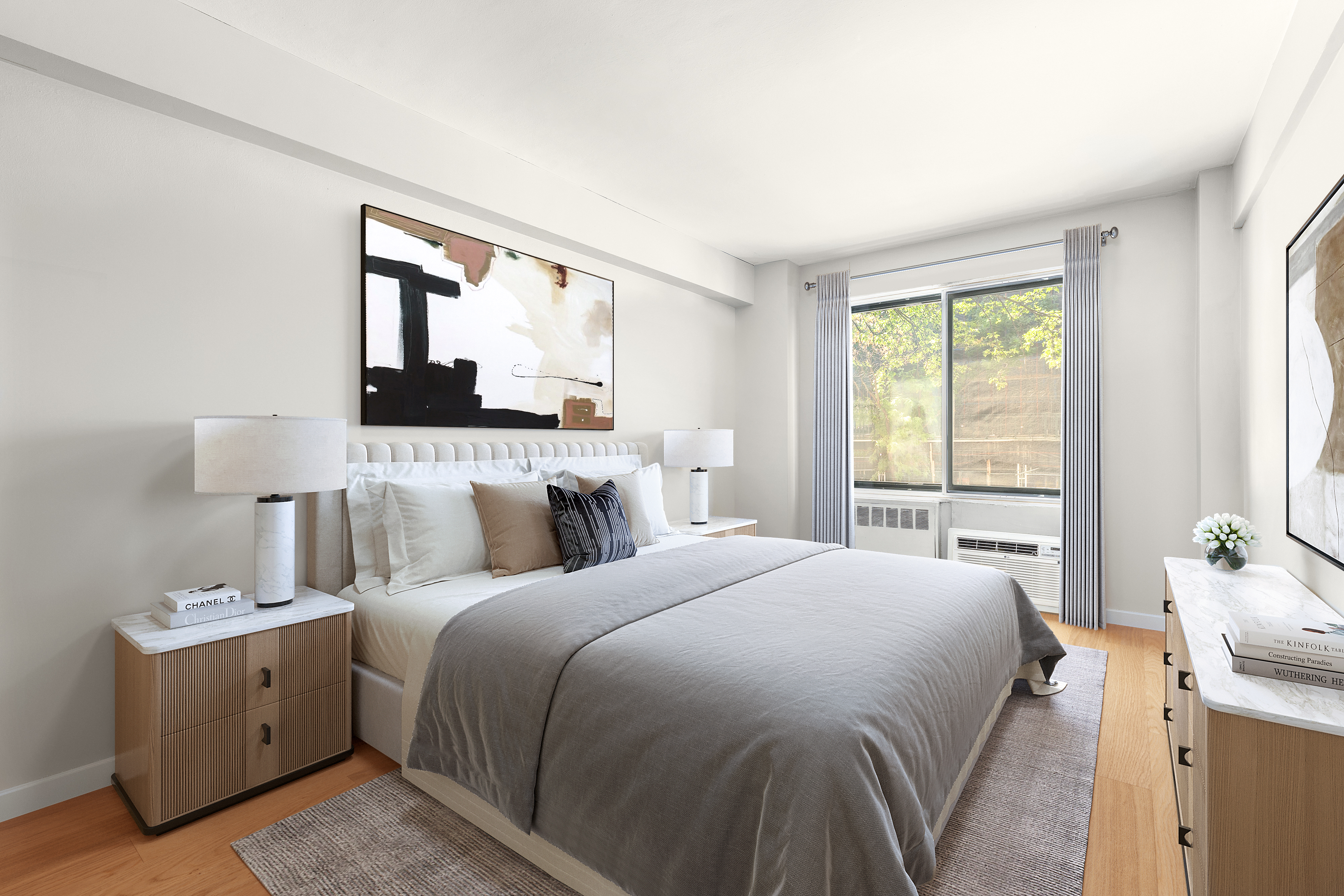 200 East 36th Street, Unit 2C Manhattan, NY 10016 - Photo 4 of 10 a bedroom with a bed and a night stand