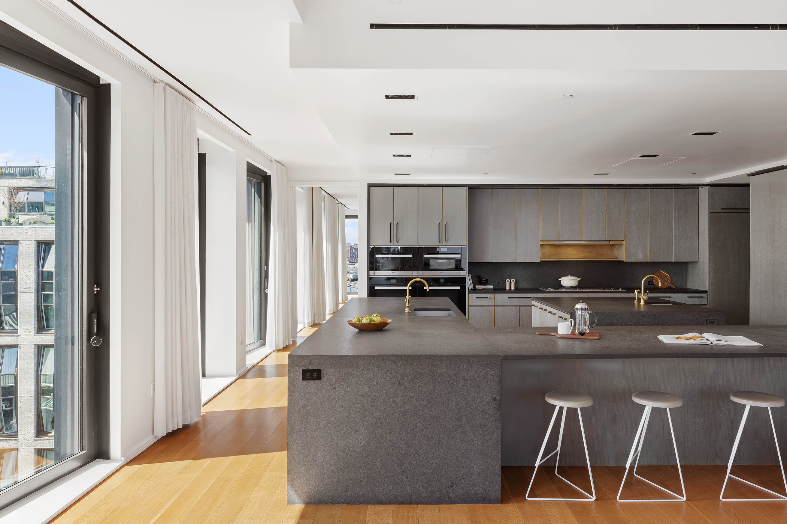 505 West 19th Street, Unit PH1 Manhattan, NY 10011 - Photo 8 of 26 a kitchen with stainless steel appliances granite countertop a sink refrigerator and cabinets