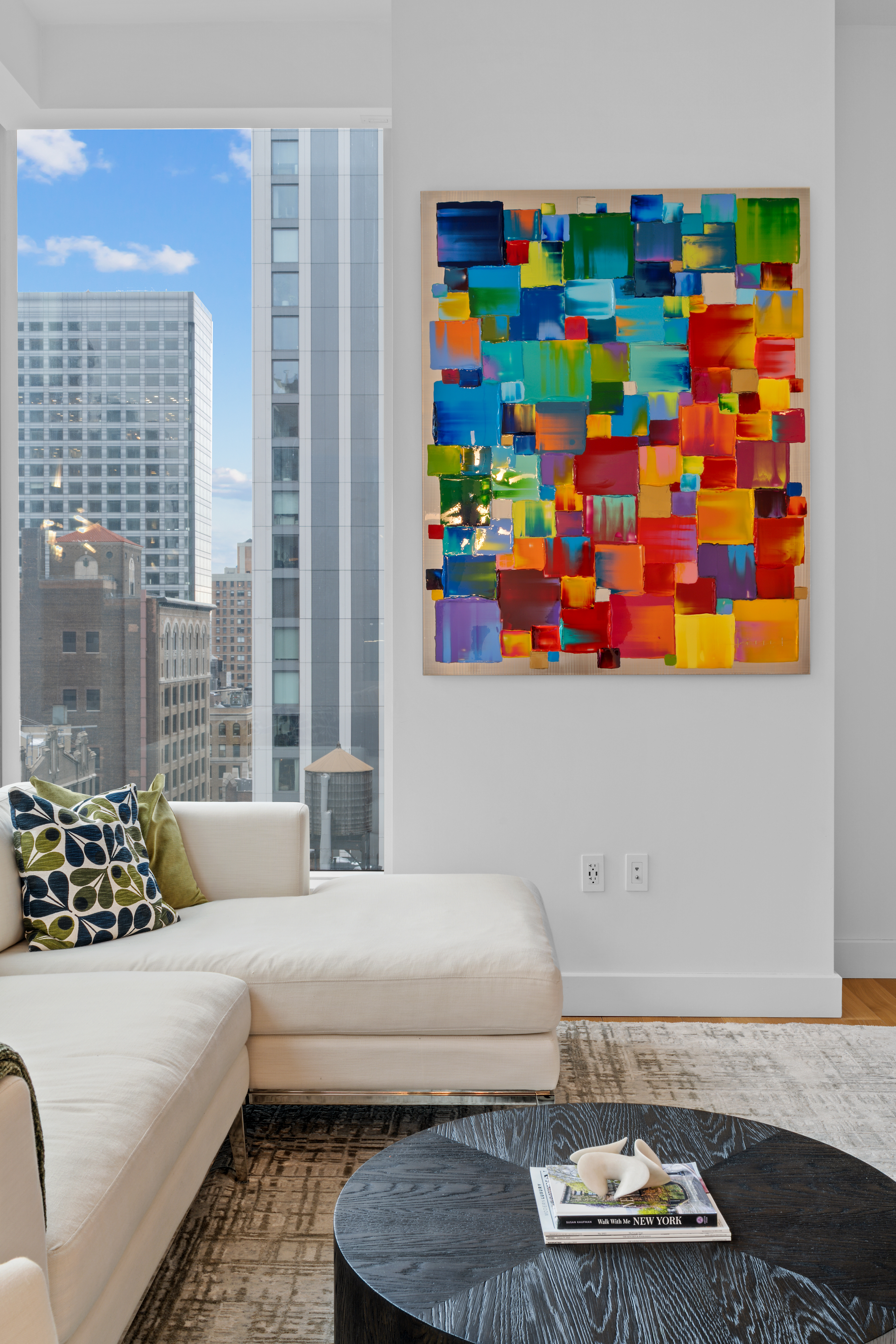 15 East 30th Street, Unit 19B Manhattan, NY 10016 - Photo 4 of 40 a living room with furniture and a couch