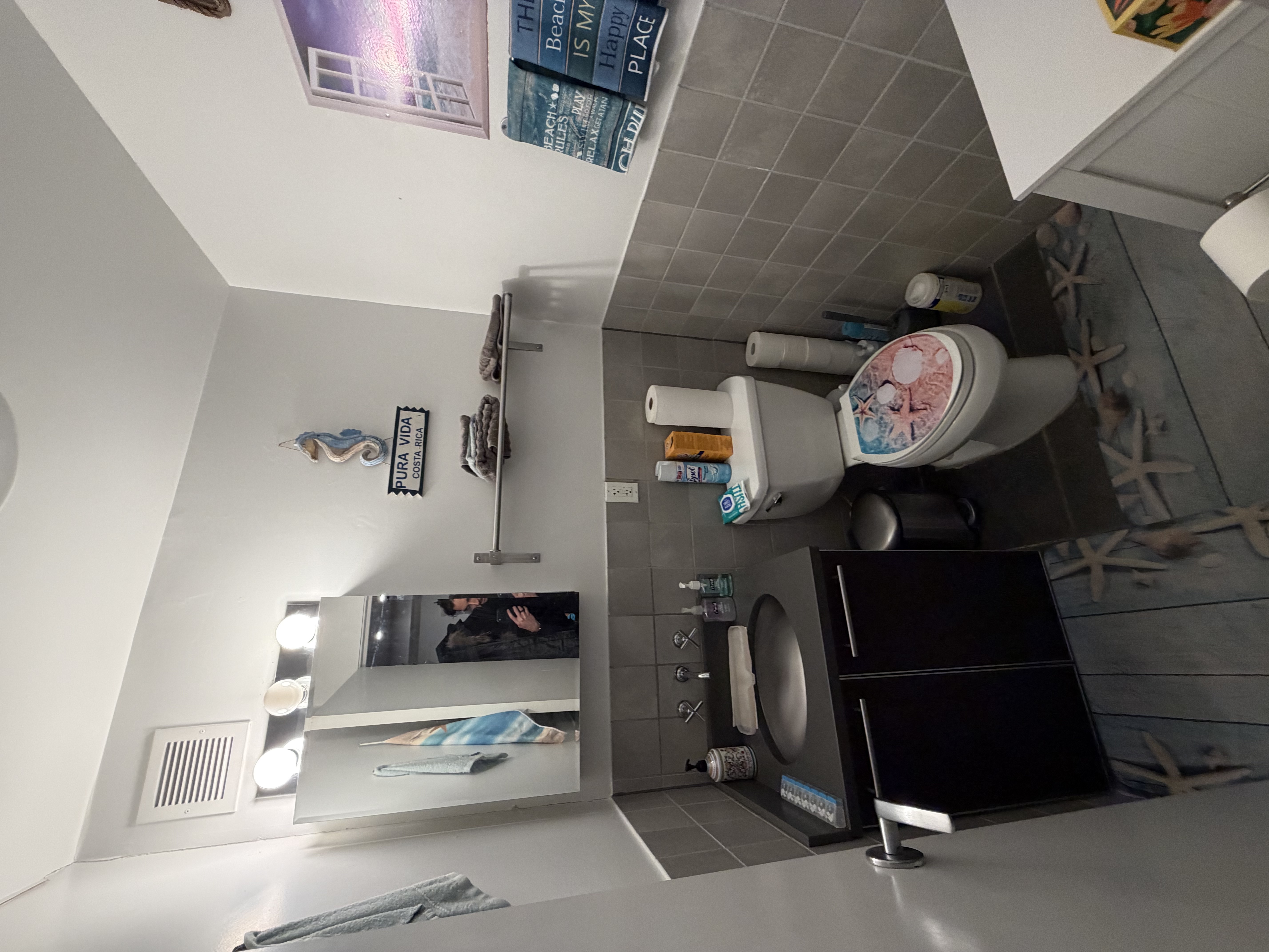 215 East 81st Street, Unit 5E Manhattan, NY 10028 - Photo 6 of 7 a bathroom with a toilet sink and mirror