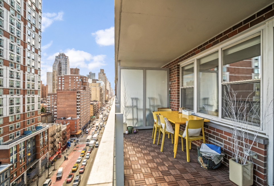 363 East 76th Street, Unit 14E Manhattan, NY 10021 - Photo 6 of 12 a view of a balcony with table and chairs