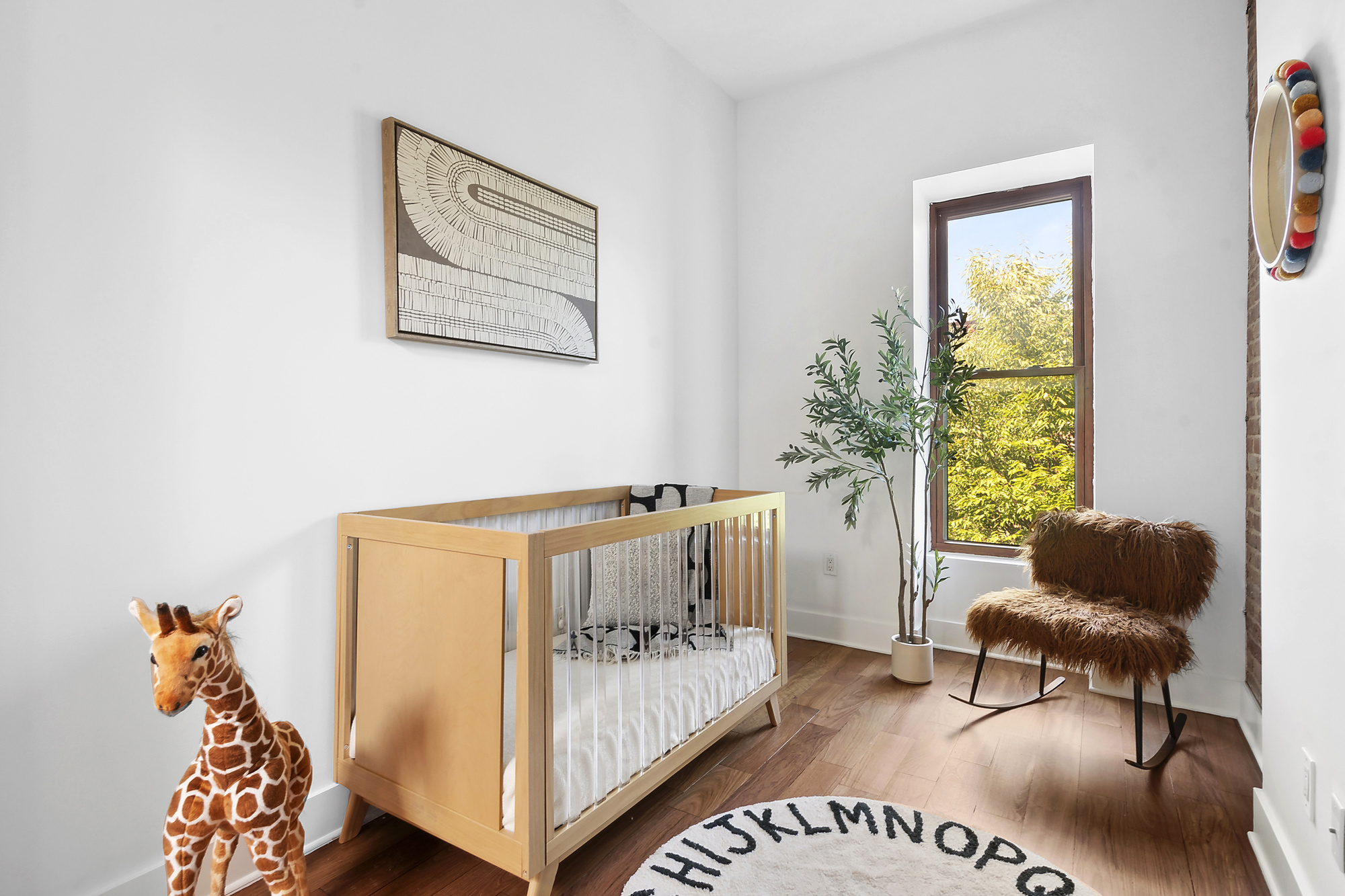 698 Halsey Street Brooklyn, NY 11233 - Photo 7 of 13 a bedroom with furniture and a large window