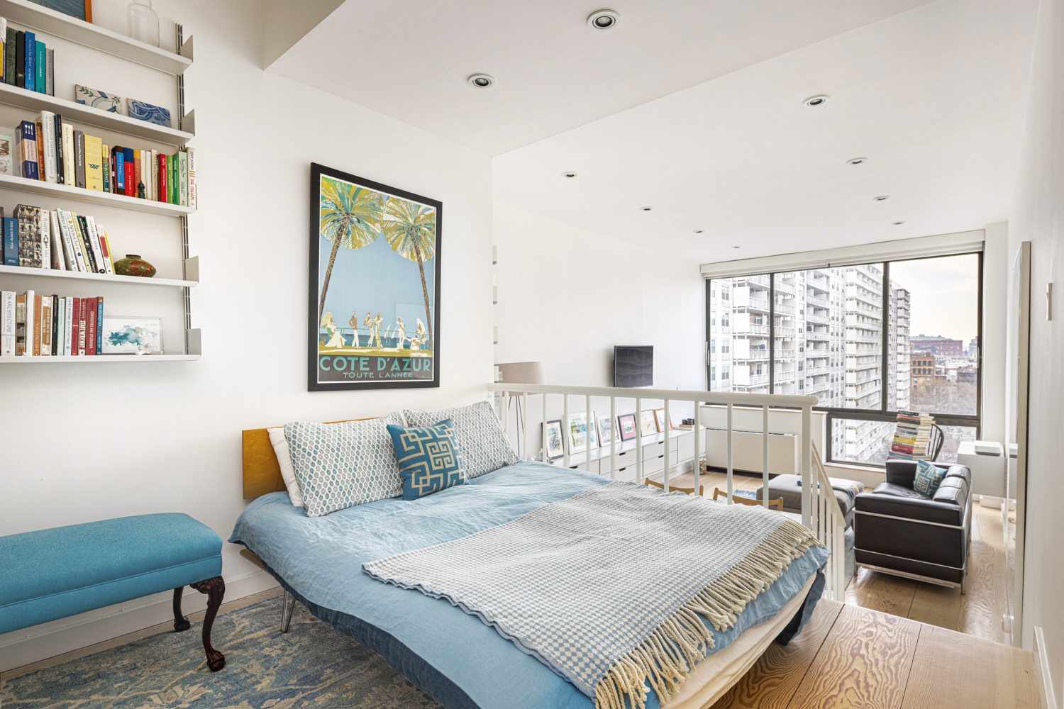 77 Bleecker Street, Unit 1006W Manhattan, NY 10012 - Photo 2 of 8 a bedroom with a bed and a large window