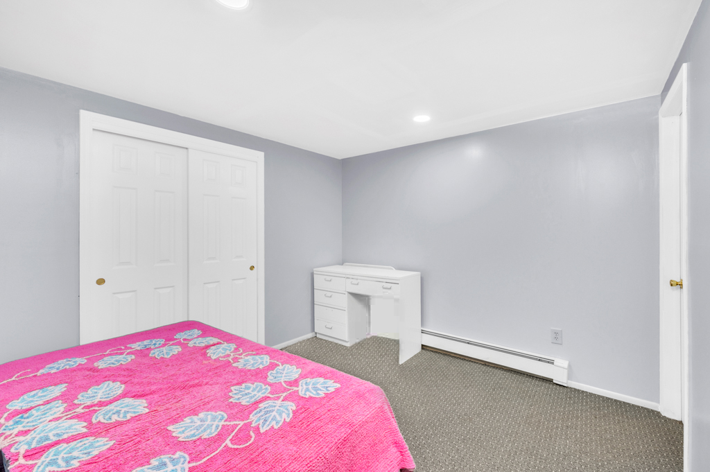 35 Poe Street Staten Island, NY 10307 - Photo 28 of 36 a bedroom with a bed and a chair