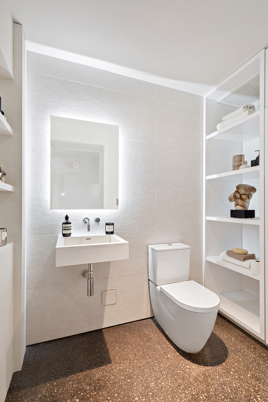 330 Wythe Avenue, Unit 6I Brooklyn, NY 11249 - Photo 11 of 14 a bathroom with a toilet a sink and a mirror