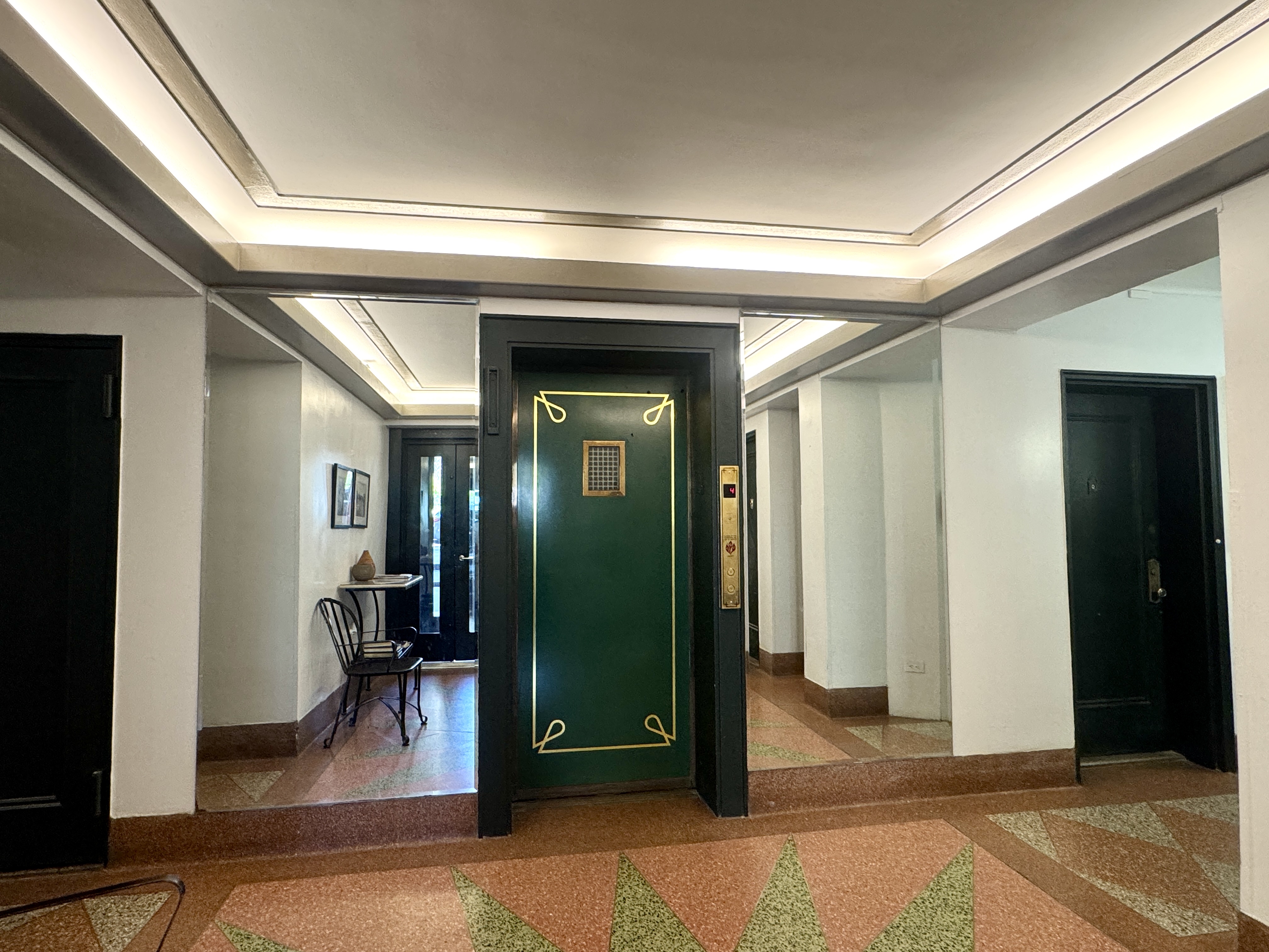 90 Park Terrace East, Unit 3B Manhattan, NY 10034 - Photo 9 of 13 a view of a hallway with wooden floor and living room